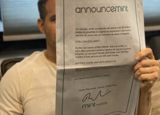 Actor Ryan Reynolds Holding NY Times Displaying Ad For Mint Mobile's Offer Of 3 Months Of Free Wireless Service
