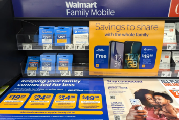 Walmart Family Mobile In Store Signage showcasing phone plans and prices for them
