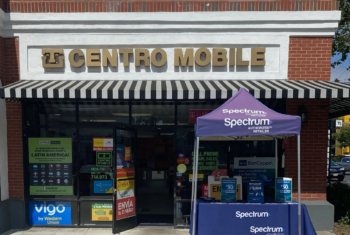 Centro Mobile multi-carrier prepaid wireless dealer storefront with signage for Simple Mobile, and a stand out in front for Spectrum Mobile