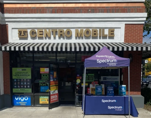 Centro Mobile multi-carrier prepaid wireless dealer storefront with signage for Simple Mobile, and a stand out in front for Spectrum Mobile