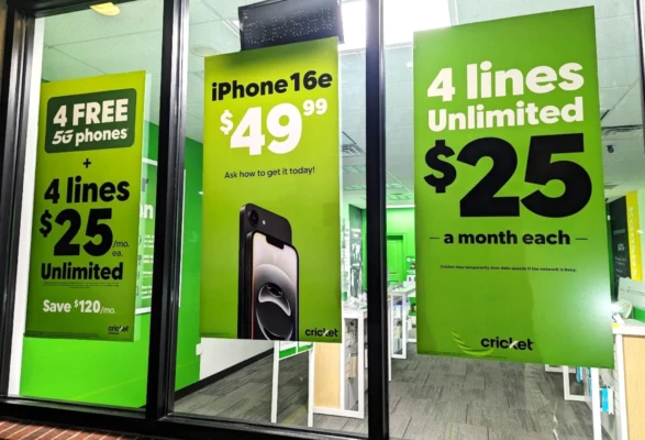 Cricket Wireless storefront with signage displayed during the 2026 tax season for 4 unlimited lines for $25 and a $49 iPhone 16e.