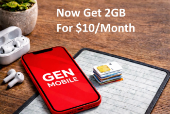 Red Gen Mobile branded smartphone resting on a wooden desk beside SIM cards and wireless earbuds, illustrating Gen Mobile’s updated prepaid phone plans.