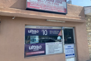 Prepaid Wireless Dealer Storefront with Ultra Mobile promo signage
