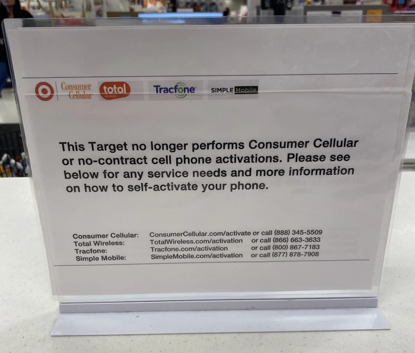 In store Target signage that says Target no longer activates Consumer Cellular or no-contract phone activations